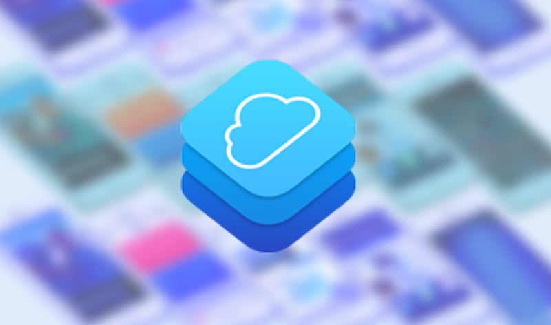Illustration of the CloudKit logo flanked by out-of-focus iPhone screenshots, tiled at an isometric angle.