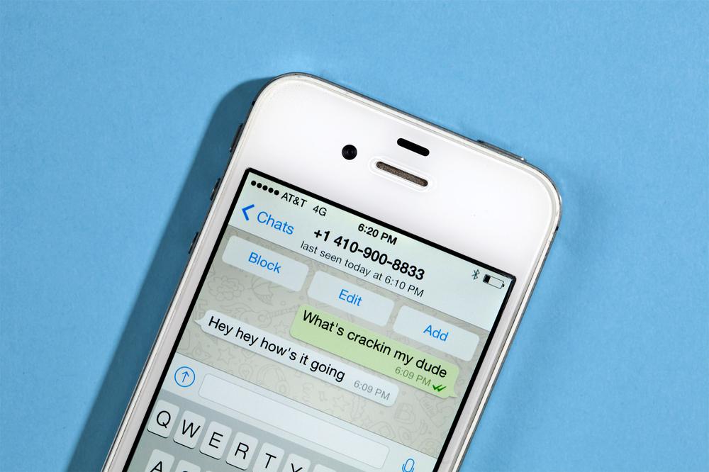 An image of an iPhone 4s running WhatsApp.