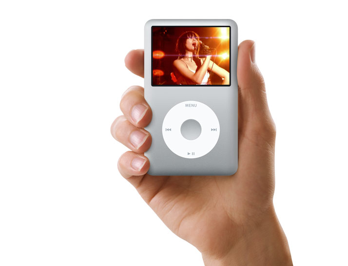 Product promotional image of a silver iPod classic, playing video, being held by a hand.